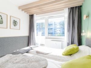 Posteľ alebo postele v izbe v ubytovaní Apartament FOREST SurfingBird Kołobrzeg