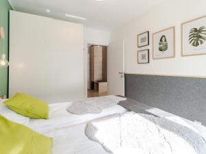 Posteľ alebo postele v izbe v ubytovaní Apartament FOREST SurfingBird Kołobrzeg