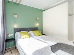 Posteľ alebo postele v izbe v ubytovaní Apartament FOREST SurfingBird Kołobrzeg