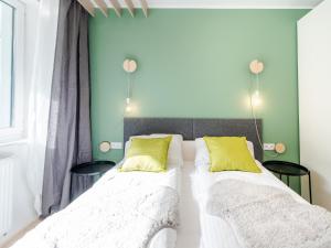 Posteľ alebo postele v izbe v ubytovaní Apartament FOREST SurfingBird Kołobrzeg