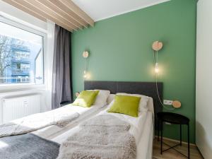 Posteľ alebo postele v izbe v ubytovaní Apartament FOREST SurfingBird Kołobrzeg + 37 fotografií