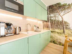 Kuchyňa alebo kuchynka v ubytovaní Apartament FOREST SurfingBird Kołobrzeg