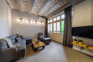 Televízia a/alebo spoločenská miestnosť v ubytovaní Groble Residence WAWELOFTS