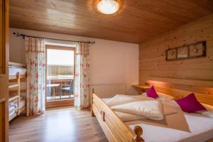 Postel nebo postele na pokoji v ubytování Urlaub am Bauernhof Windhaghof