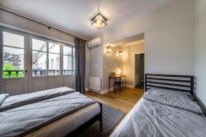 Posteľ alebo postele v izbe v ubytovaní Groble Residence WAWELOFTS