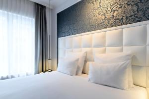 Postel nebo postele na pokoji v ubytování Hotel Rubens-Grote Markt