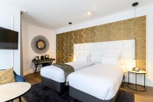 Postel nebo postele na pokoji v ubytování Hotel Rubens-Grote Markt