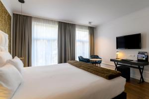 TV a/nebo společenská místnost v ubytování Hotel Rubens-Grote Markt