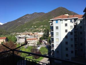 a view of a city with mountains in the background at Casa Miramonti in Perosa Argentina