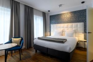 Кровать или кровати в номере Hotel Rubens-Grote Markt