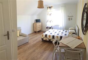 TV a/nebo společenská místnost v ubytování Marea Apartamenty Ustka
