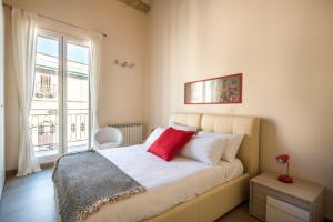 Krevet ili kreveti u jedinici u objektu Santa Cecilia Apartments by Wonderful Italy