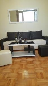 a living room with a couch and a table at marini in Tbilisi City
