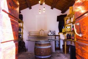 a bar in a wine tasting room with a barrel at Il Palazzo Ridracoli in Bagno di Romagna