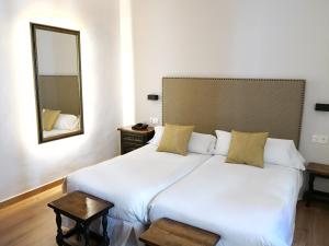 Postel nebo postele na pokoji v ubytování Palacio de Monjaraz