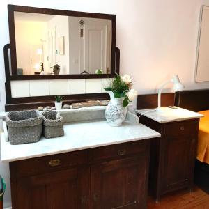 a bathroom counter with a sink and a mirror at Studio Doklestic in Dubrovnik
