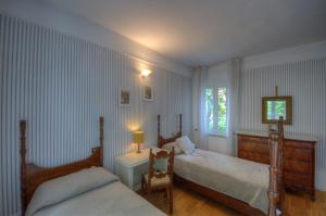 A bed or beds in a room at Appartamento in Villa a 5 KM dal mare