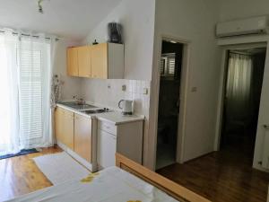 Kuchyň nebo kuchyňský kout v ubytování Apartment Coskovic