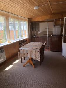 a dining room with a table in a kitchen at квартира in Kislovodsk