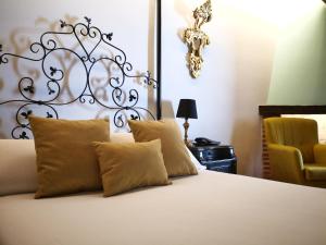 Llit o llits en una habitació de Palacio de Monjaraz