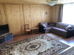 a living room with a couch and a tv at квартира in Kislovodsk