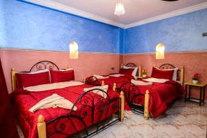Cama o camas de una habitación en Hôtel Faouzi