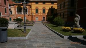 a brick walkway in front of a building at Casa Vacanze Matilda in Varazze