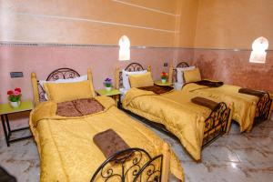 Cama o camas de una habitación en Hôtel Faouzi
