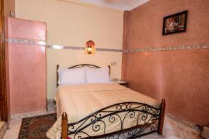 Cama o camas de una habitación en Hôtel Faouzi