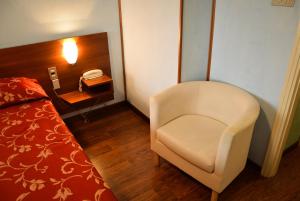 Postel nebo postele na pokoji v ubytování Hotel Salieri