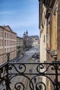 a view of a city street from a balcony at Grace Apartments in Krakow