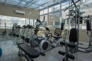 a gym with a row of exercise bikes at Hotel Centro Europeu in Curitiba
