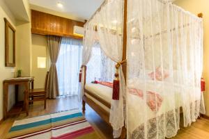 Letto o letti in una camera di Hotel Mala Pokhara