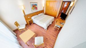 A bed or beds in a room at Bull Astoria