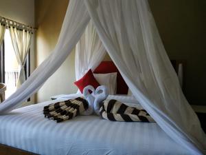Ein Bett oder Betten in einem Zimmer der Unterkunft Villa di Amed