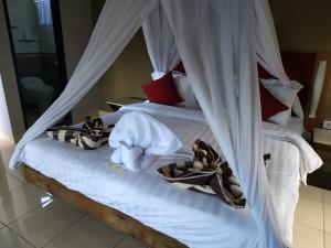Ein Bett oder Betten in einem Zimmer der Unterkunft Villa di Amed