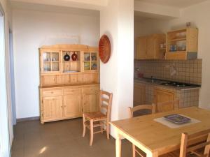 Virtuvė arba virtuvėlė apgyvendinimo įstaigoje Appartamento uso piscina