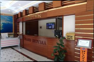 a lobby of a hotel with a reception desk at Grand Didyma Hotel in Didim +53 photos