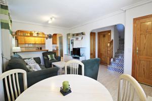 a living room with a couch and a table at Veramar 6 in Vera