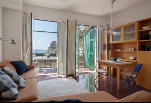 a living room with a view of the ocean at Orizzonte sul mare in Monterosso al Mare