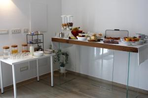 a table with a bunch of food on it at ARIA Design B&B Levanto in Levanto