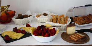 a table with a bunch of different types of food at ARIA Design B&B Levanto in Levanto