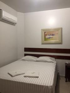 Cama ou camas em um quarto em Vidagi Palace Hotel