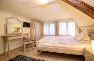 מיטה או מיטות בחדר ב-Mango Rooms