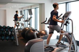 a group of people in a gym on treadmills at ibis Styles Jakarta Tanah Abang in Jakarta