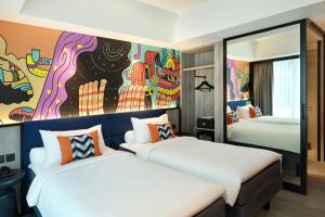 ibis Styles Jakarta Tanah Abang客房内的一张或多张床位