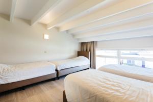 
Ein Bett oder Betten in einem Zimmer der Unterkunft Holiday Home Jonckershof
