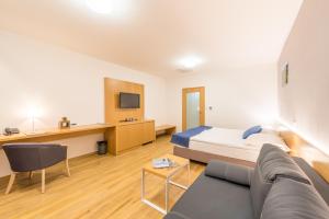 Postel nebo postele na pokoji v ubytování Hotel Kaskáda