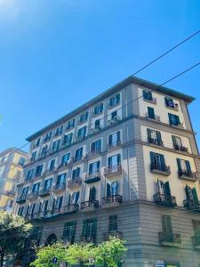 a tall building with balconies on the side of it at Nacu 90 in Naples