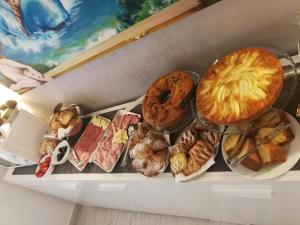 a box filled with different types of bread and pastries at B&B Il Mare degli Dei in Letojanni